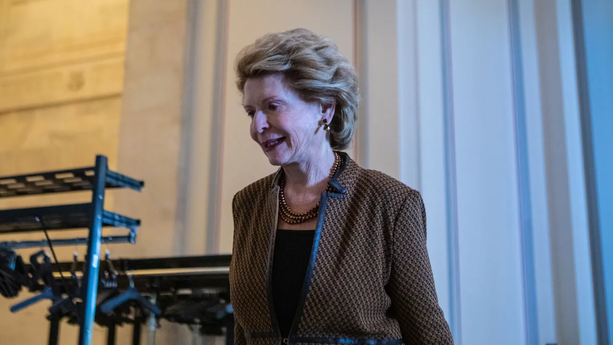 Sen. Debbie Stabenow of Michigan walks into a room