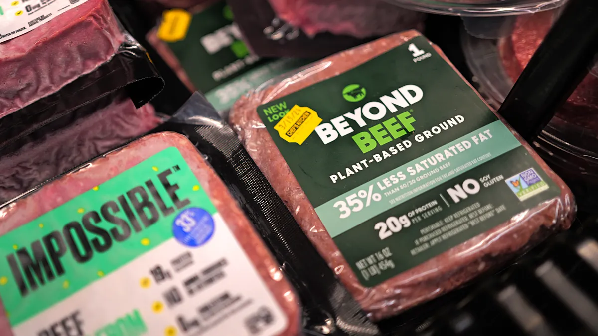 Package of plant-based ground beef are seen in a grocery aisle