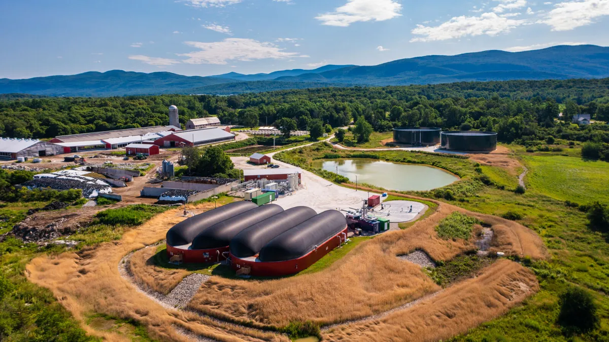 Industrial organics recycling site located on a Vermont farm, with mountains and blue sky in the background