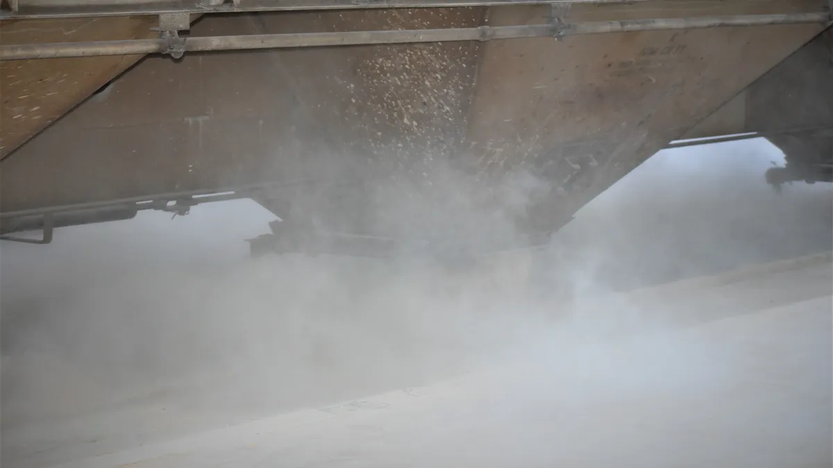 Railcar unloading with dust in the air